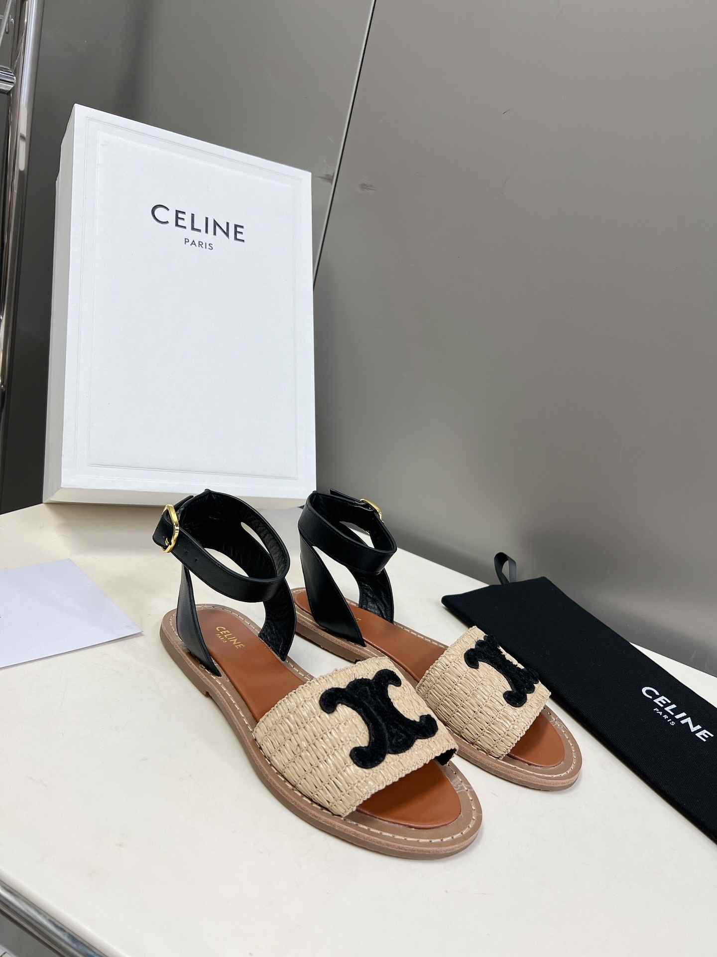 Ce1i*e Lympia Flat Strap Sandal In Raffia Black For Women 352402248C.02BL
